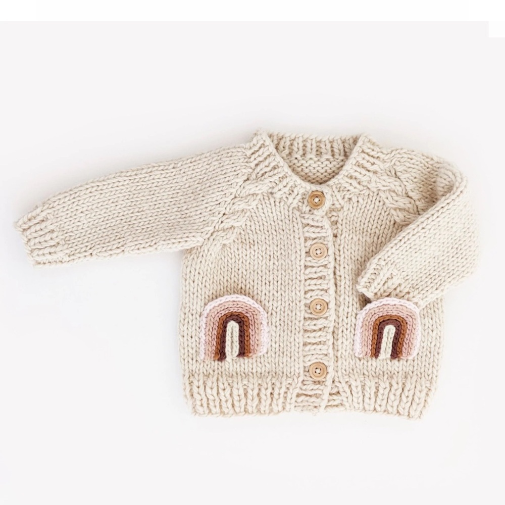 Huggalugs sz 2-3T cream colored cardigan with rainbow pockets